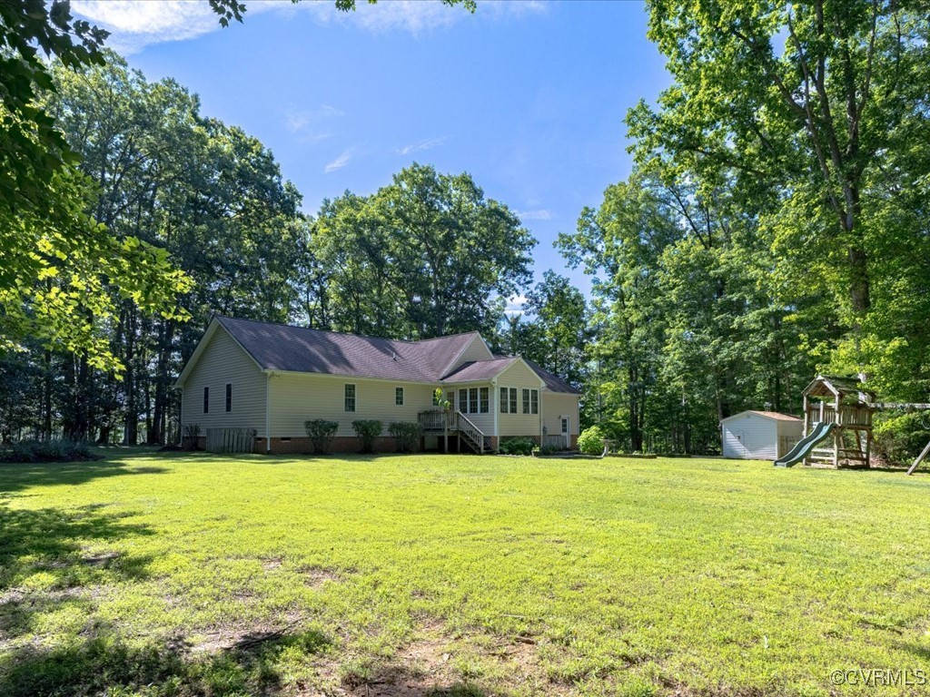 1875 Capeway Road Powhatan, VA 23139 - Photo 3 of 42 a view of swimming pool and trees in the background