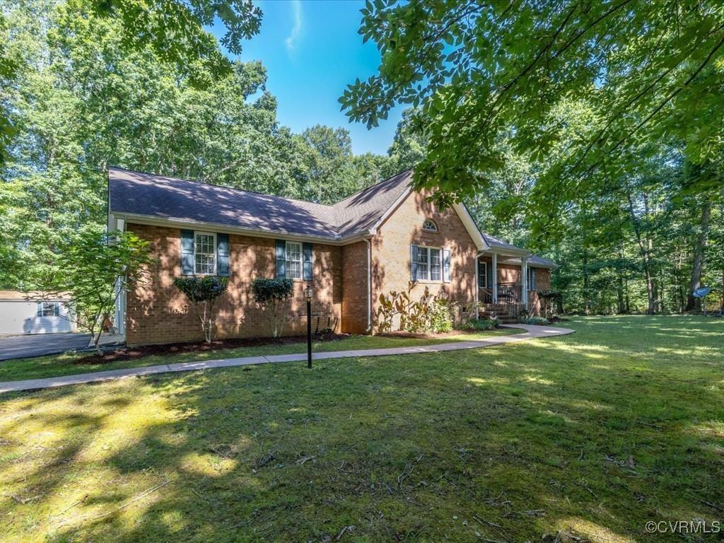 1875 Capeway Road Powhatan, VA 23139 - Photo 32 of 42 a front view of a house with a garden