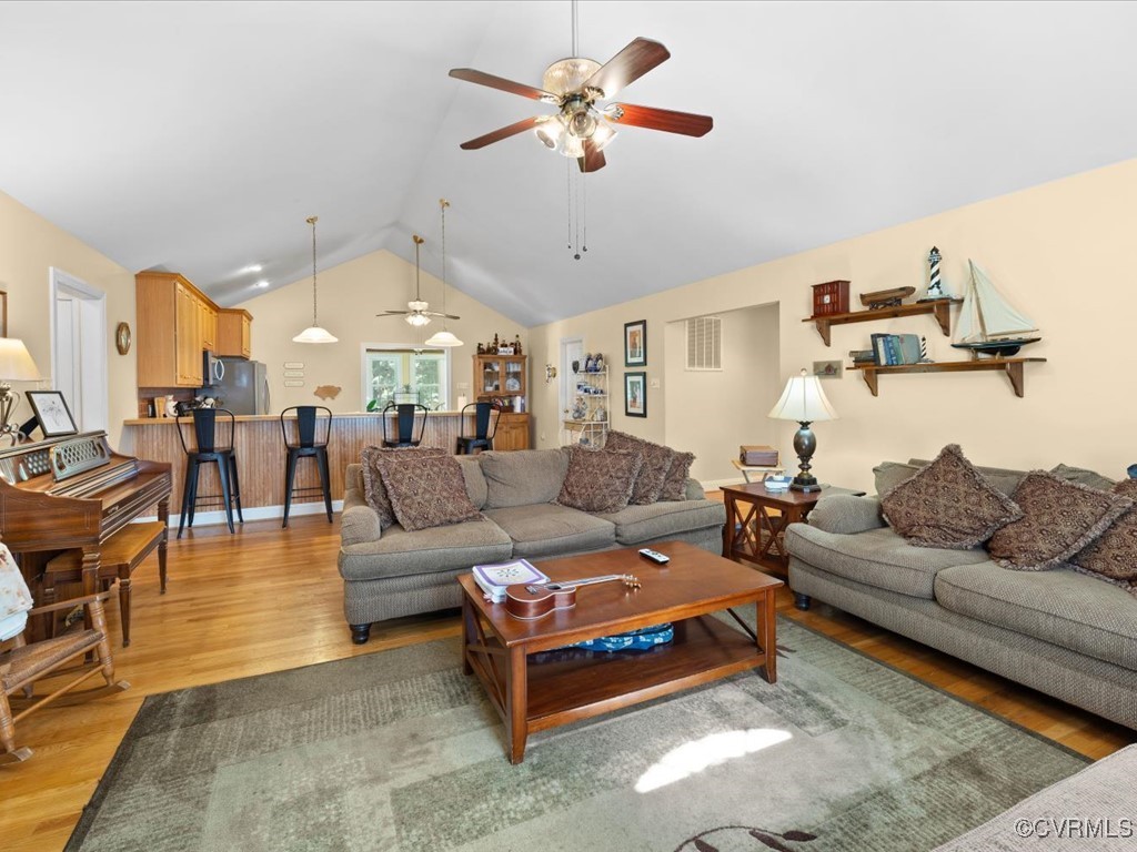1875 Capeway Road Powhatan, VA 23139 - Photo 4 of 42 a living room with furniture ceiling fan and a rug