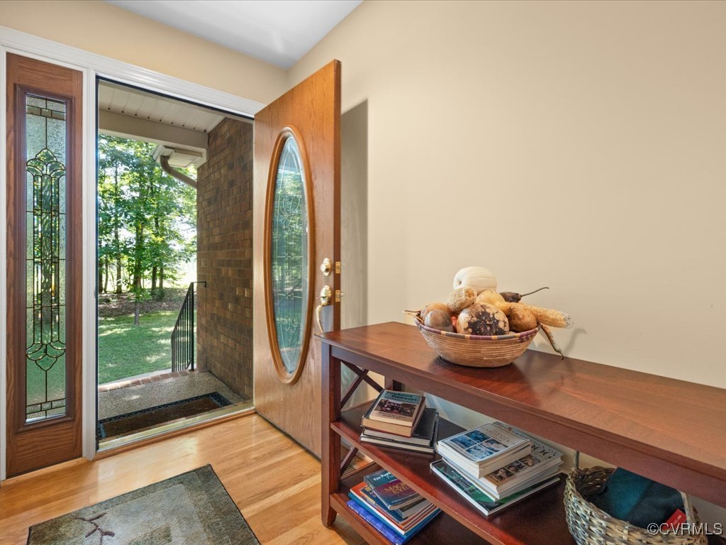 1875 Capeway Road Powhatan, VA 23139 - Photo 6 of 42 a living room with furniture and a floor to ceiling window