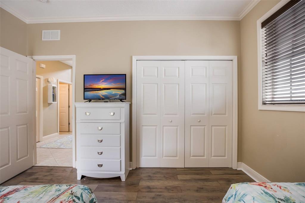 318 64th Street Holmes Beach, FL 34217 - Photo 24 of 33 a view of bedroom with a bed and flat screen tv