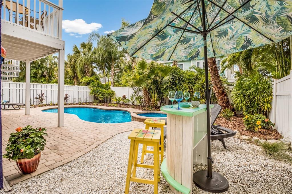 318 64th Street Holmes Beach, FL 34217 - Photo 25 of 33 a view of a pathway of a house with a yard