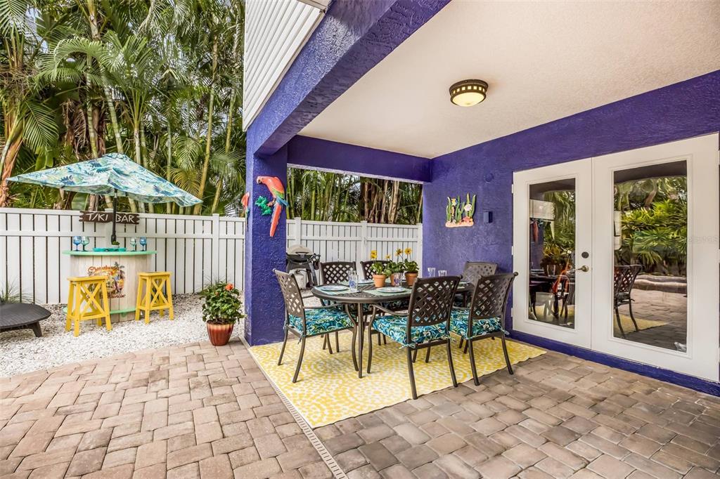 318 64th Street Holmes Beach, FL 34217 - Photo 27 of 33 a view of a patio with a table and chairs
