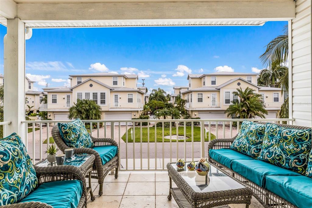 318 64th Street Holmes Beach, FL 34217 - Photo 31 of 33 a view of a balcony with furniture
