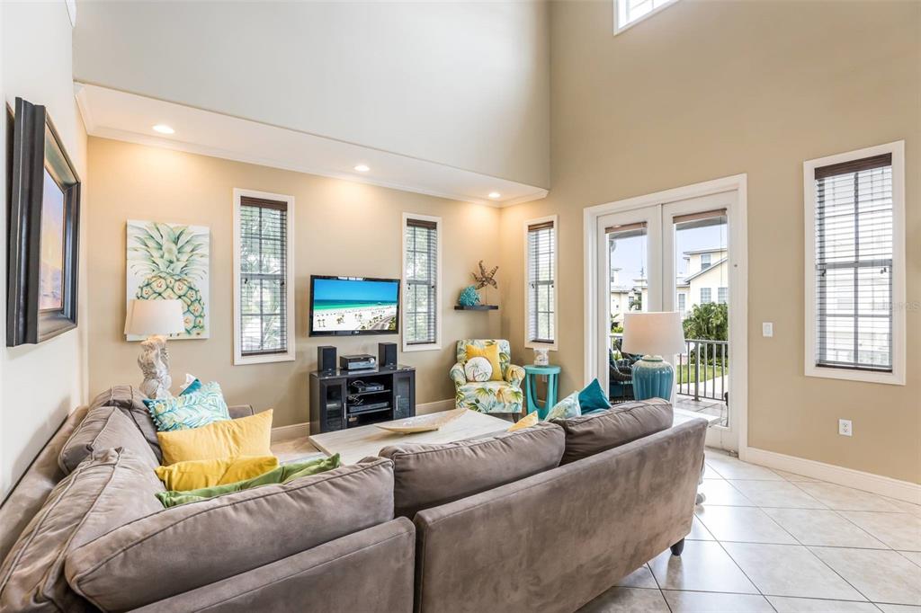318 64th Street Holmes Beach, FL 34217 - Photo 8 of 33 a living room with furniture and a flat screen tv
