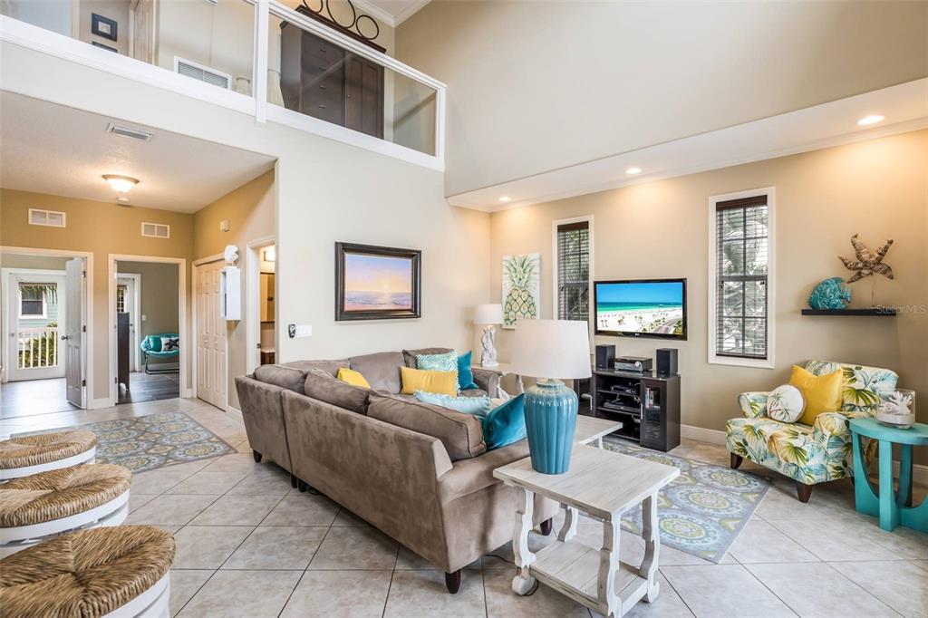 318 64th Street Holmes Beach, FL 34217 - Photo 9 of 33 a living room with furniture and a flat screen tv