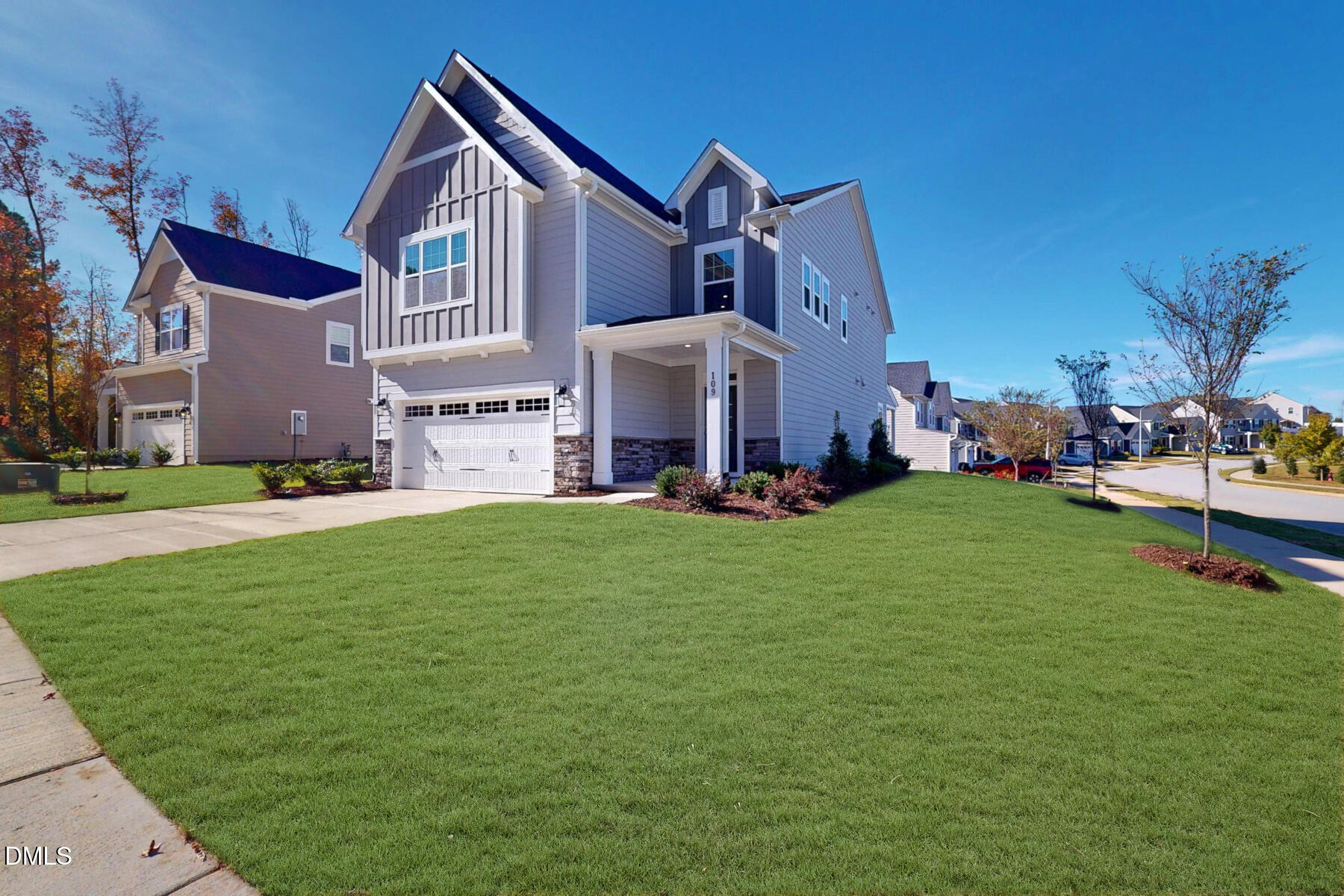 109 Tawny Slope Court, Unit 13 Raleigh, NC 27603 - Photo 2 of 48 a front view of house with yard and outdoor seating