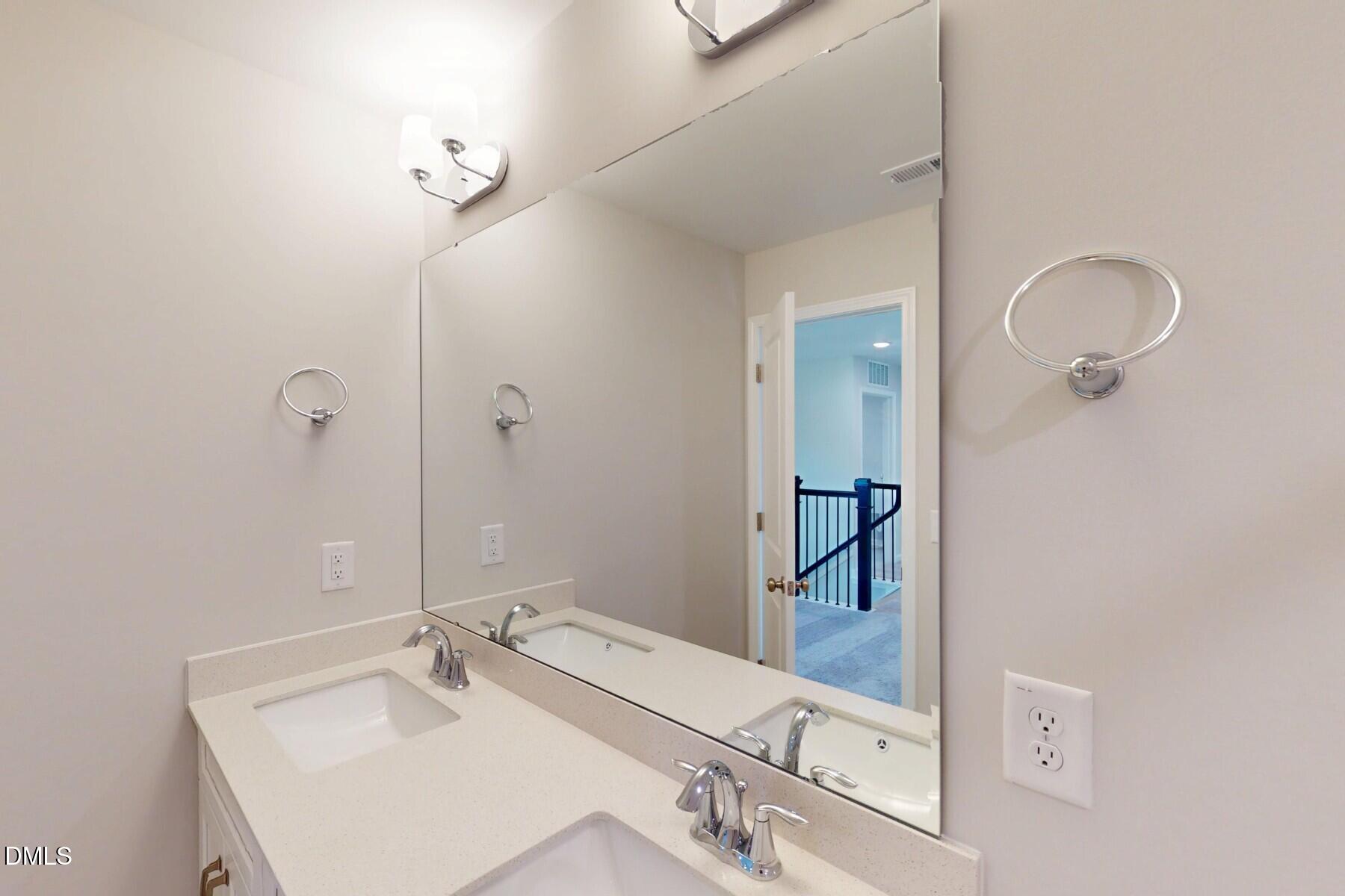 109 Tawny Slope Court, Unit 13 Raleigh, NC 27603 - Photo 28 of 48 a bathroom with a sink and a mirror