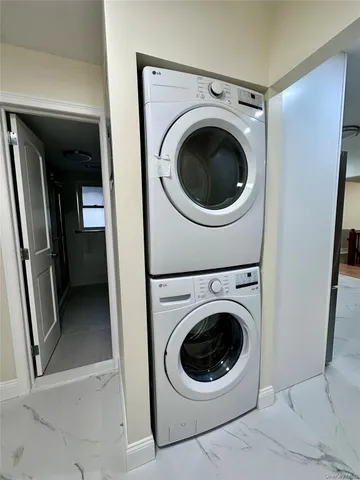 a view of a hallway with washer and dryer