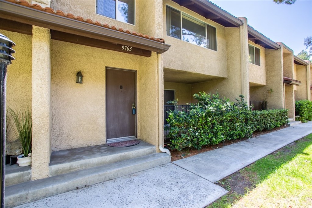 9763 Vía Pavia Burbank, CA 91504 - Photo 1 of 1 a front view of a house with garden