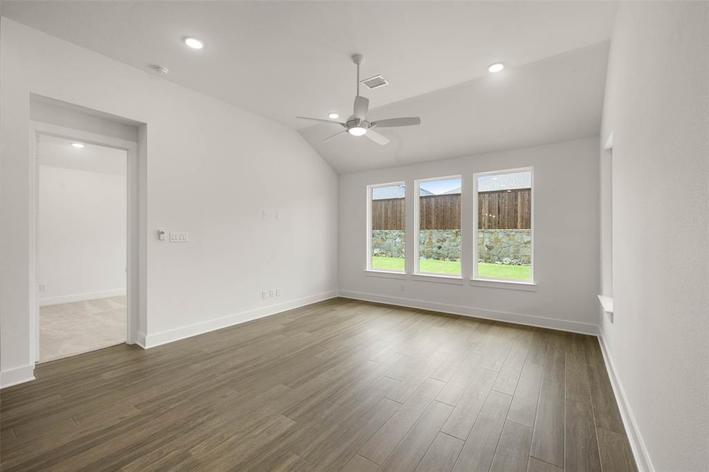 2223 Shady Elm Road Midlothian, TX 76065 - Photo 11 of 27 an empty room with wooden floor and windows