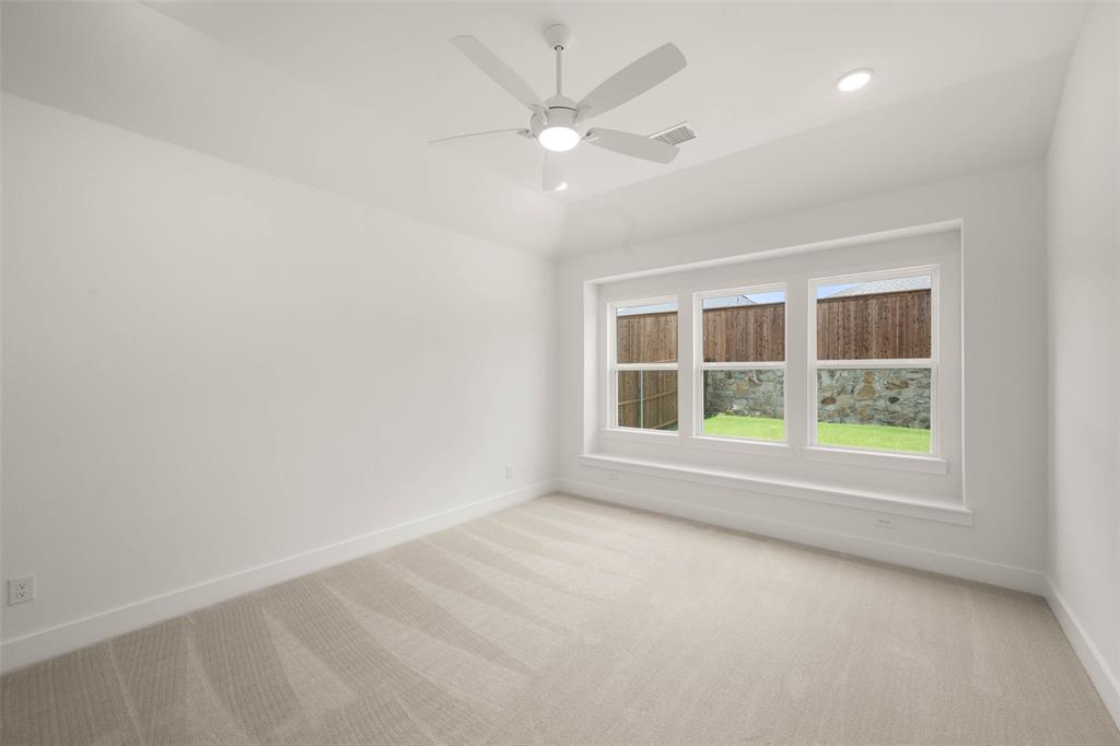 2223 Shady Elm Road Midlothian, TX 76065 - Photo 14 of 27 an empty room with a window and a fan