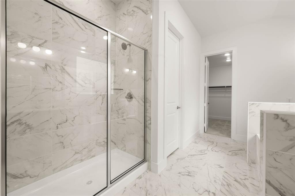 2223 Shady Elm Road Midlothian, TX 76065 - Photo 16 of 27 a bathroom with a glass shower door