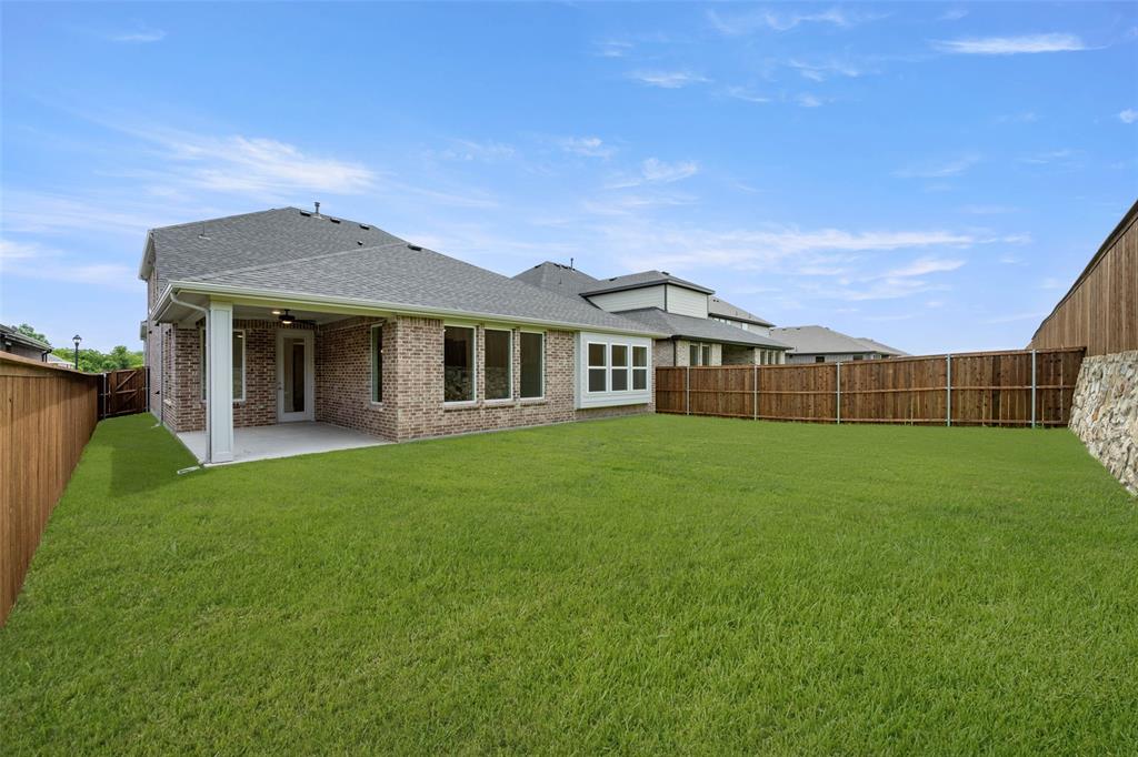 2223 Shady Elm Road Midlothian, TX 76065 - Photo 27 of 27 a view of a house with a backyard