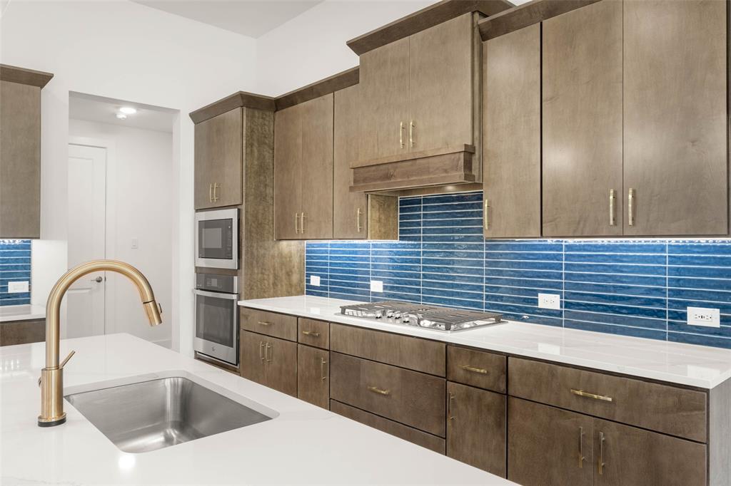 2223 Shady Elm Road Midlothian, TX 76065 - Photo 8 of 27 a kitchen with a sink and cabinets