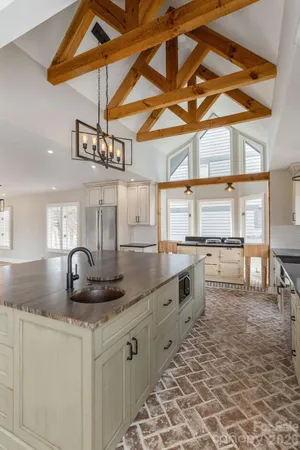a kitchen with stainless steel appliances granite countertop a sink and cabinets