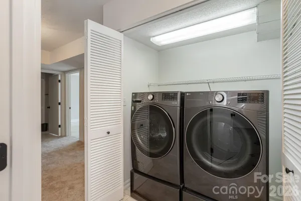 a utility room with dryer and washer