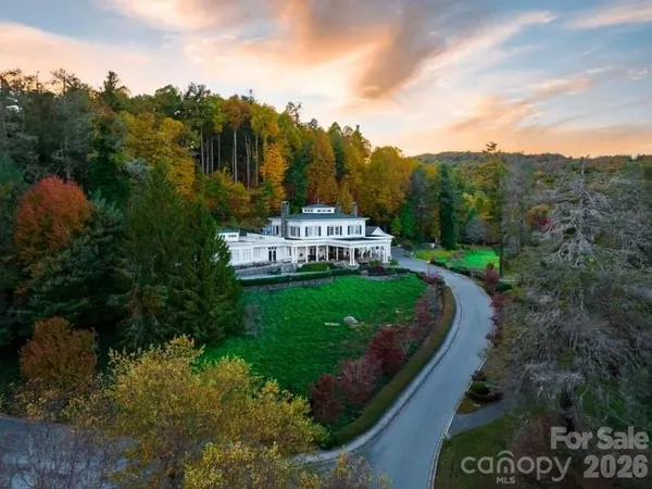 a view of a street with of a house in the background
