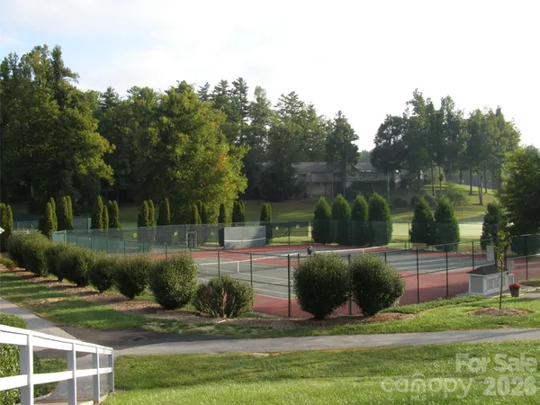a view of a swimming pool with a lawn chairs