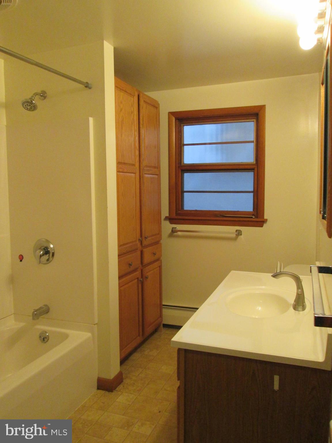 315 York Road Carlisle, PA 17013 - Photo 14 of 14 a bathroom with a sink a mirror and a bathtub
