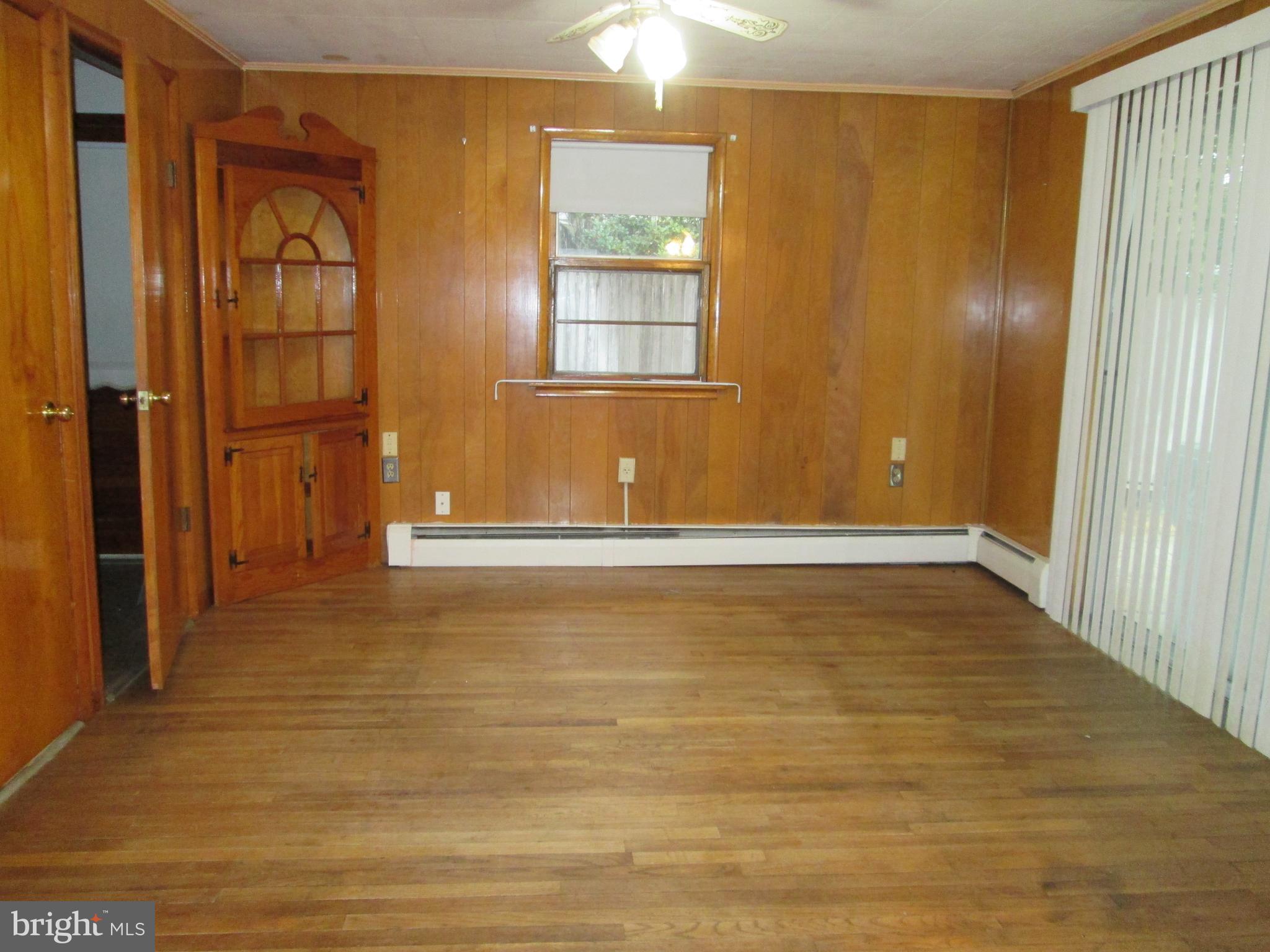 315 York Road Carlisle, PA 17013 - Photo 3 of 14 a view of an empty room with wooden floor and a window