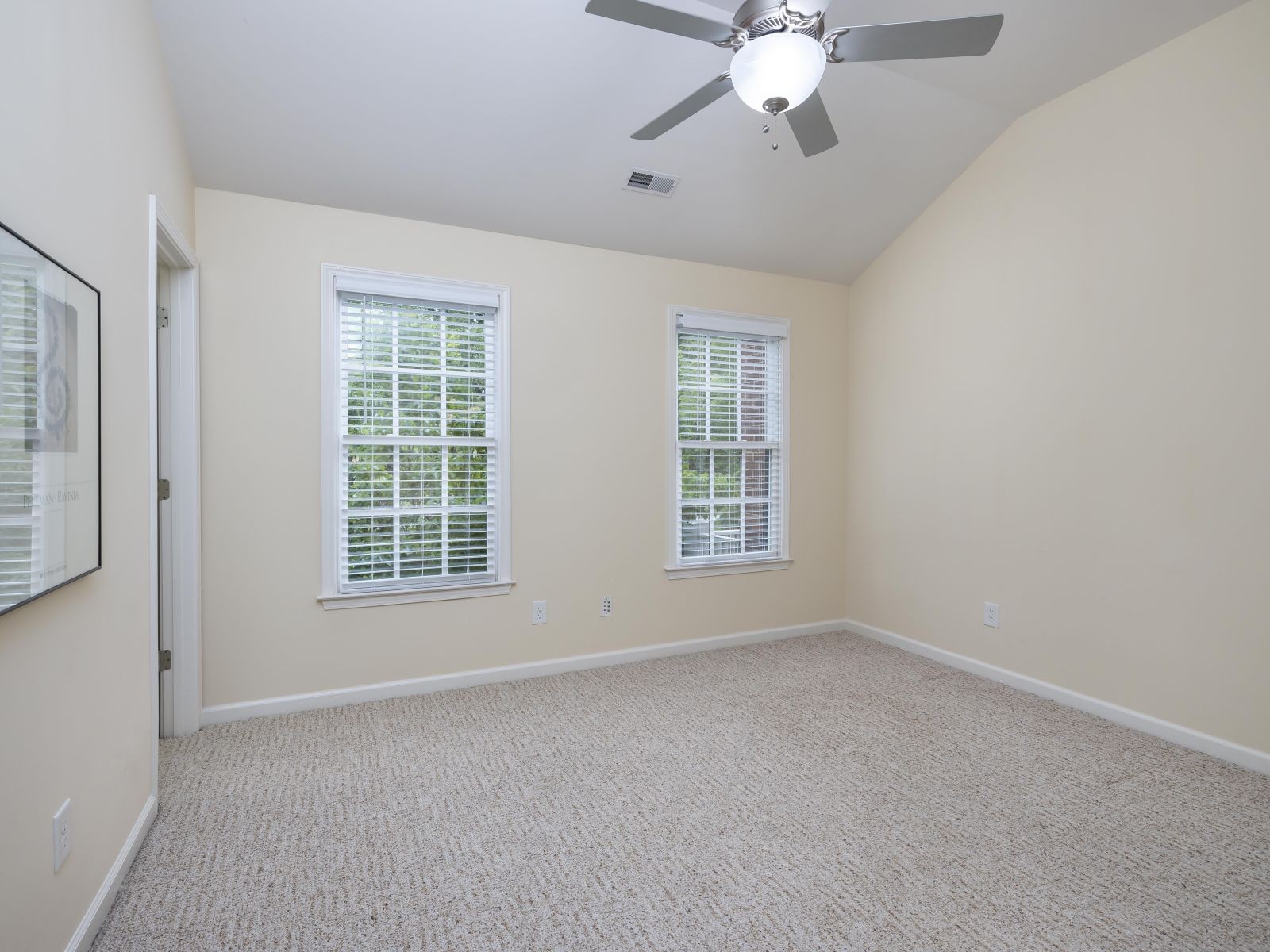 110 Pearl Street Franklin, TN 37064 - Photo 29 of 38 an empty room with chandelier fan and windows
