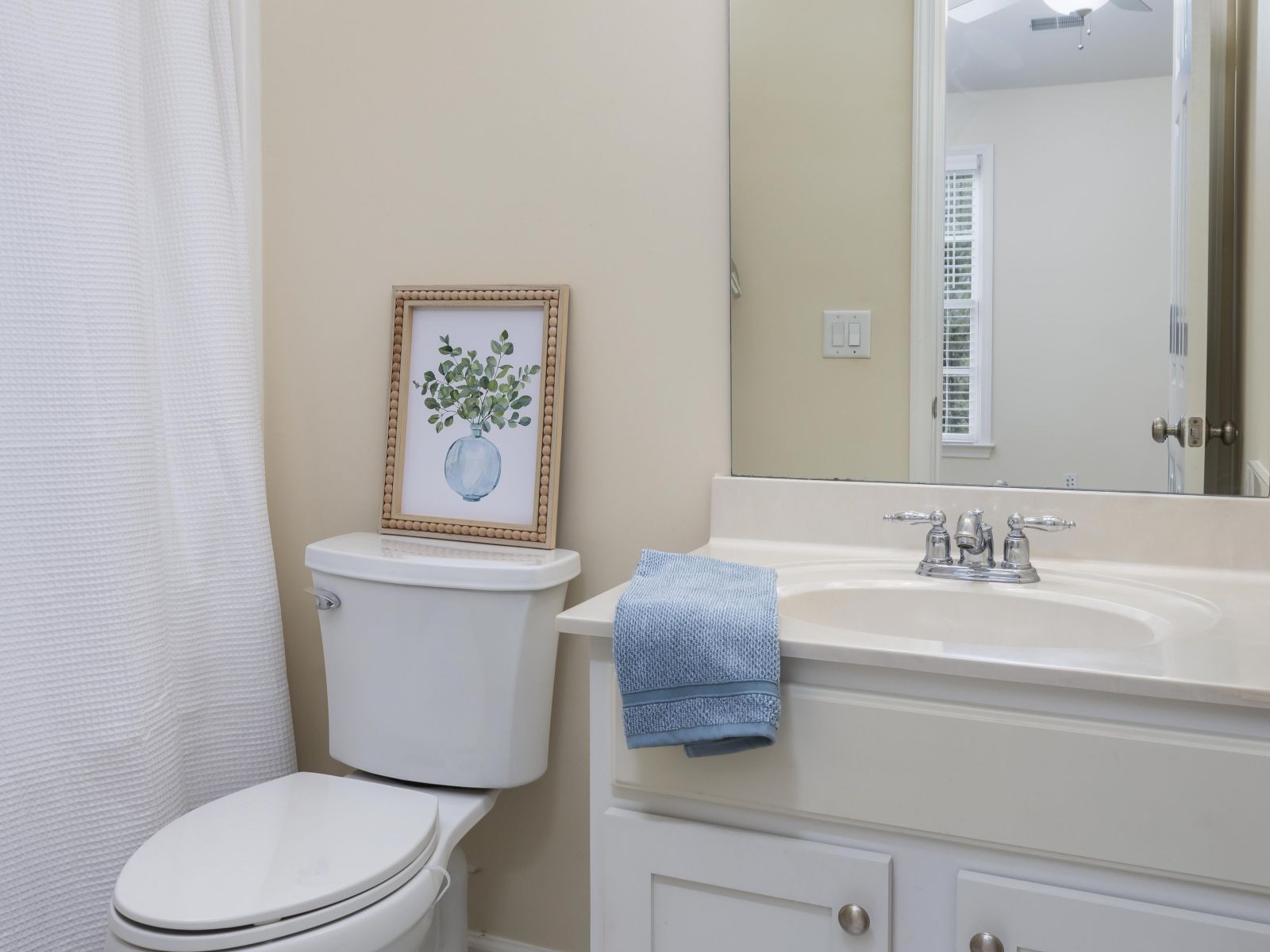 110 Pearl Street Franklin, TN 37064 - Photo 31 of 38 a white toilet sitting next to a bathroom sink