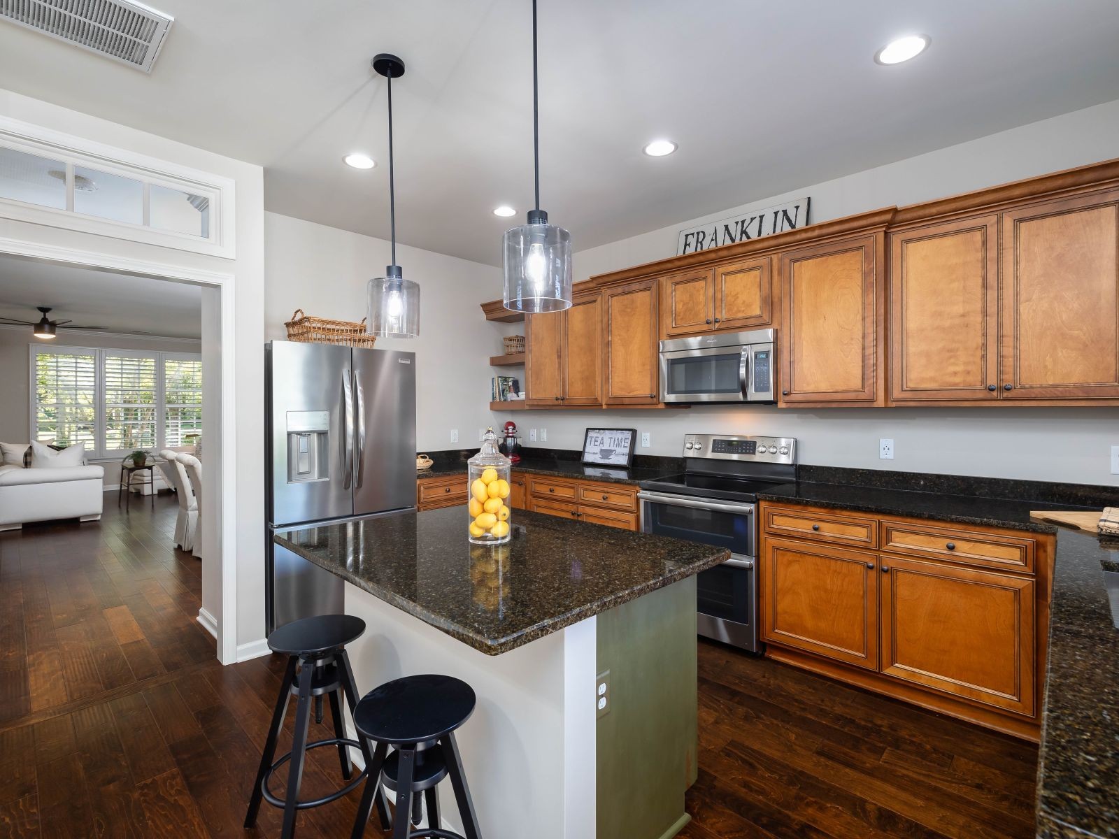 110 Pearl Street Franklin, TN 37064 - Photo 10 of 38 a kitchen with stainless steel appliances granite countertop a refrigerator a stove and a wooden floors