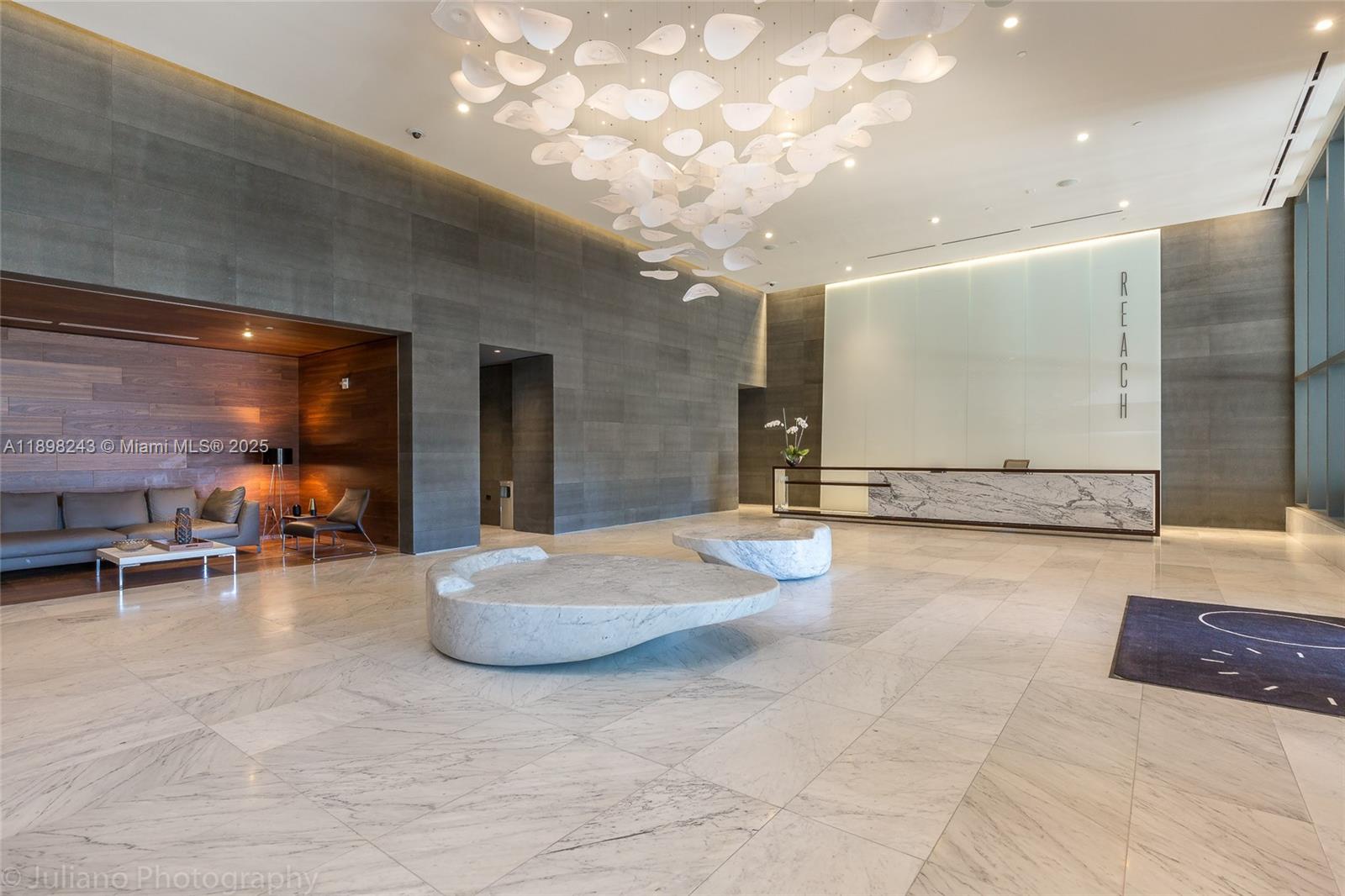 68 Southeast 6th Street, Unit 3906 Miami, FL 33131 - Photo 46 of 48 a large hall with exercise machine and windows