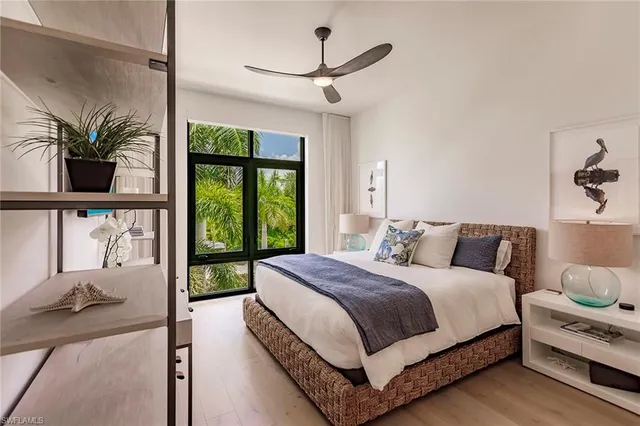 a bedroom with a large bed and a window