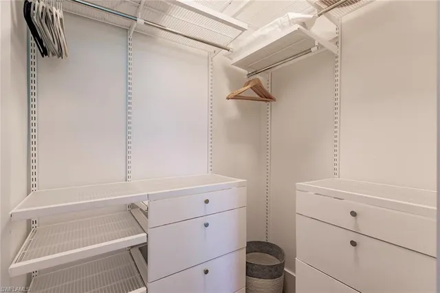 a view of a storage and utility room with racks on the wall