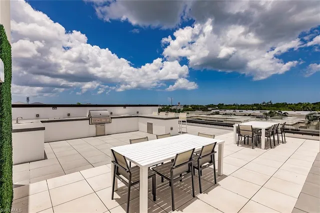 a view of dinning table and chairs in patio