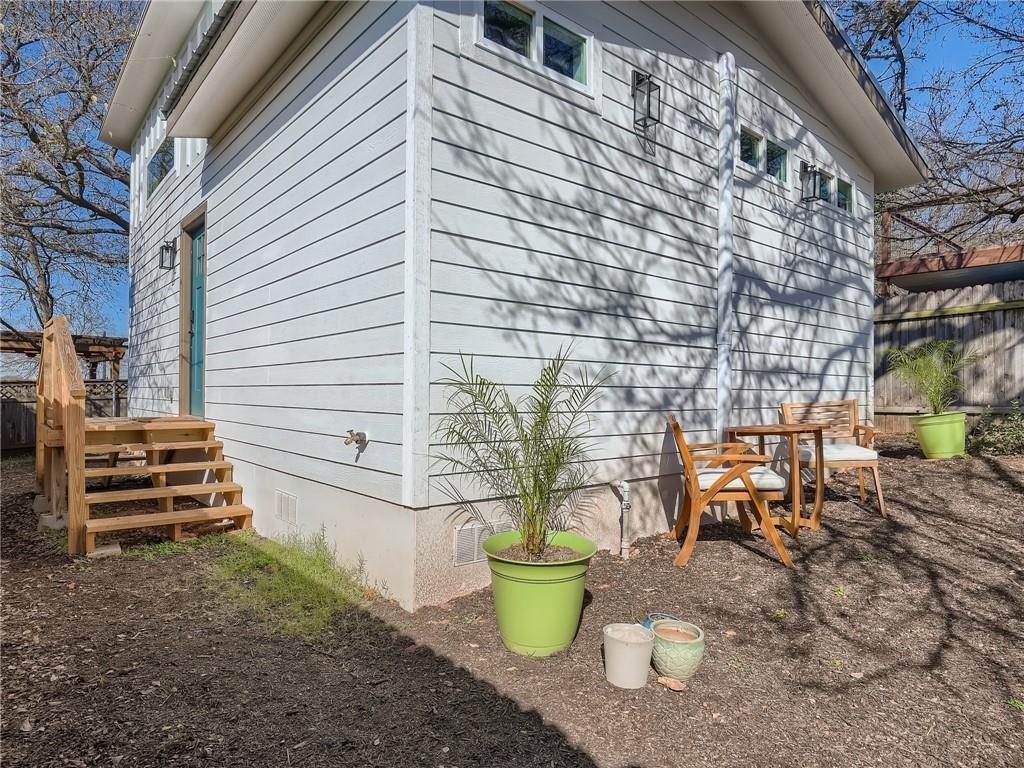 1614 Elmira Road Austin, TX 78721 - Photo 12 of 23 View of property exterior with crawl space and a wooden deck