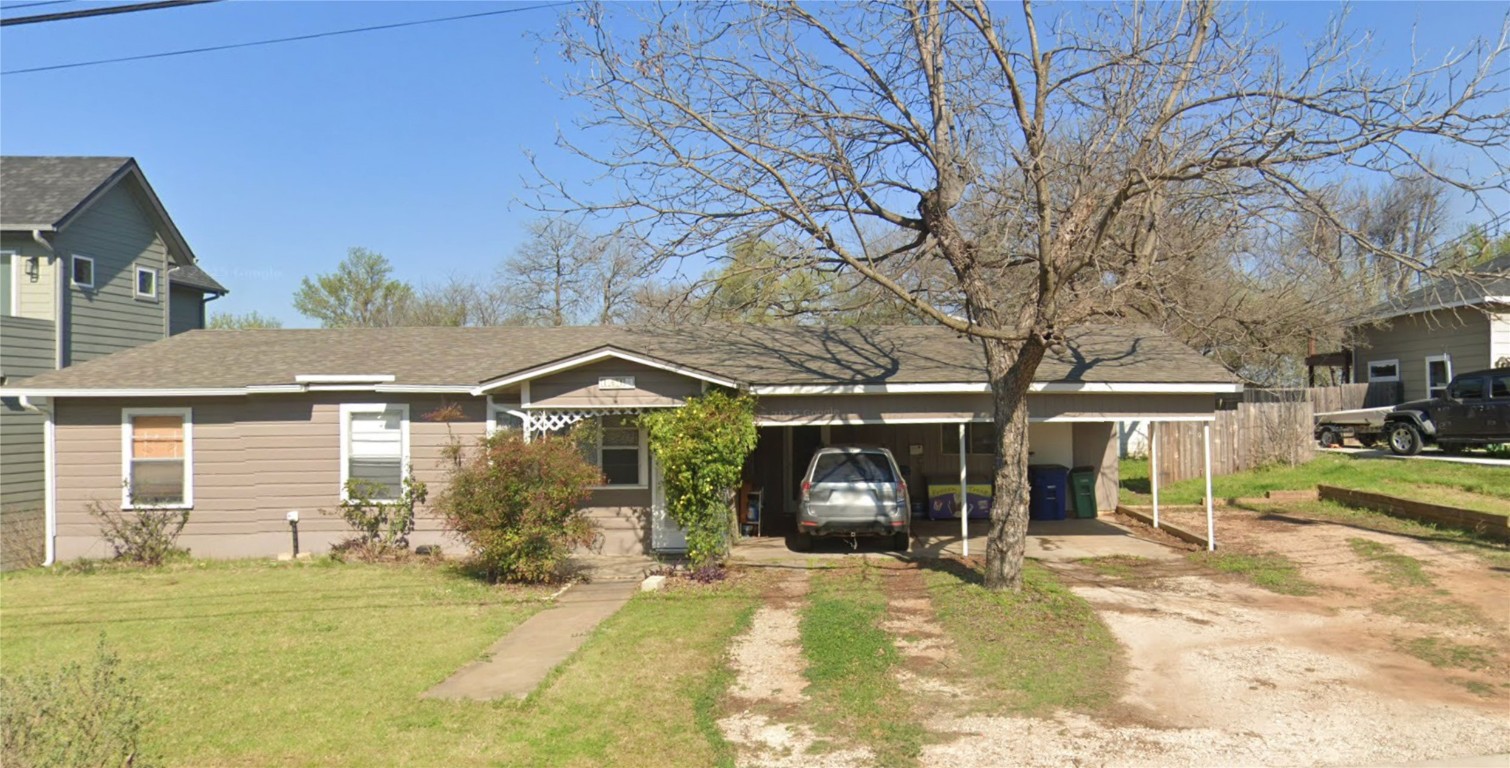 1614 Elmira Road Austin, TX 78721 - Photo 14 of 23 View of front of property with a front yard, driveway, an attached carport, and covered porch
