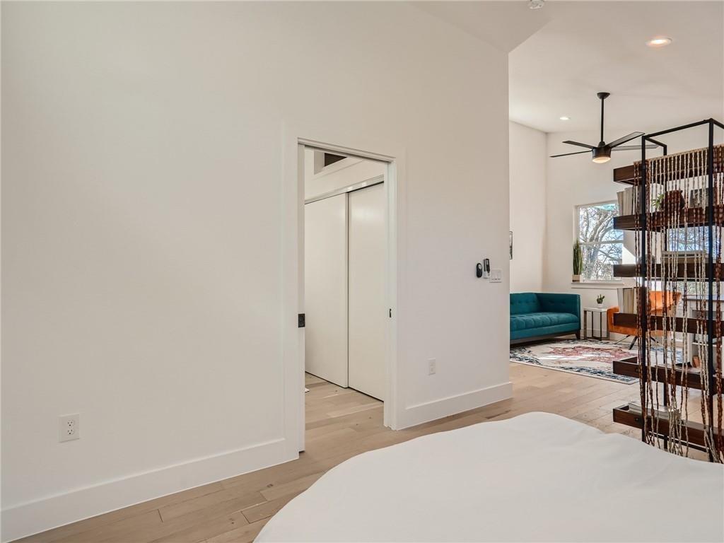 1614 Elmira Road Austin, TX 78721 - Photo 7 of 23 Bedroom with light wood-type flooring, a closet, and recessed lighting