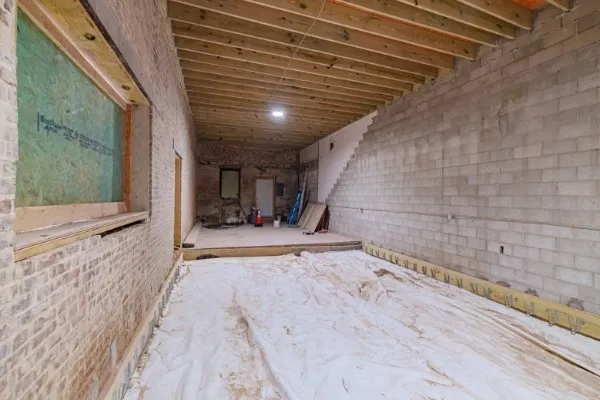 a view of an empty room with wooden walls