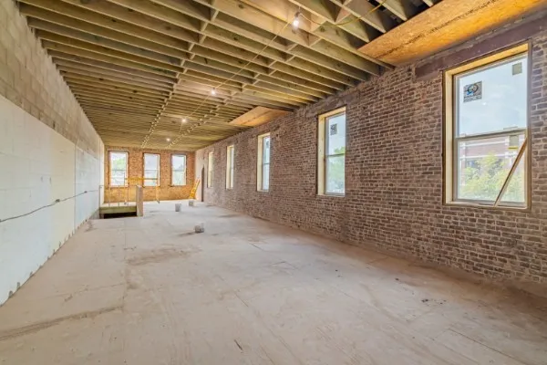 a view of a balcony with furniture