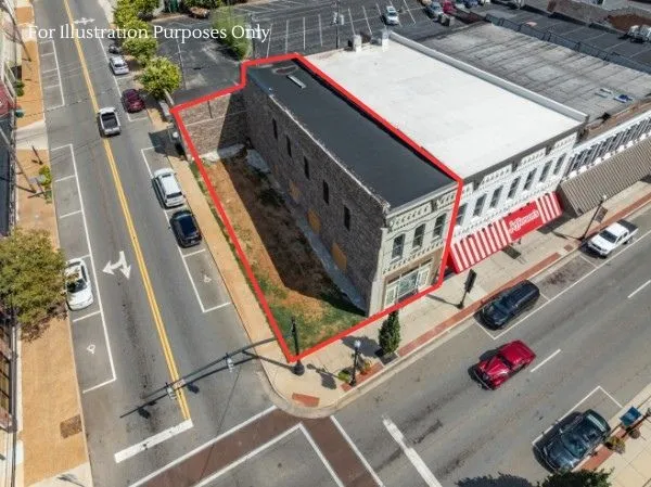 a view of a building with sitting area