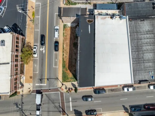 an aerial view of a houses with outdoor space