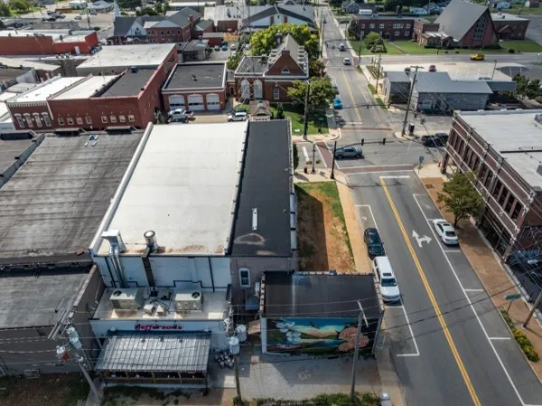 an aerial view of a city with lots of residential buildings