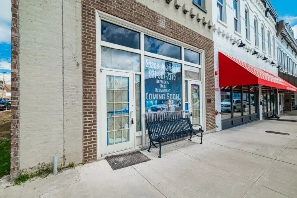 a brick building with a yard