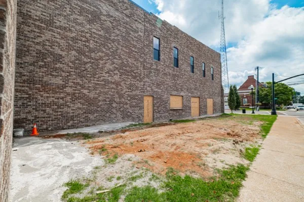 a view of street with tall buildings