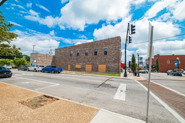 a view of a street with cars