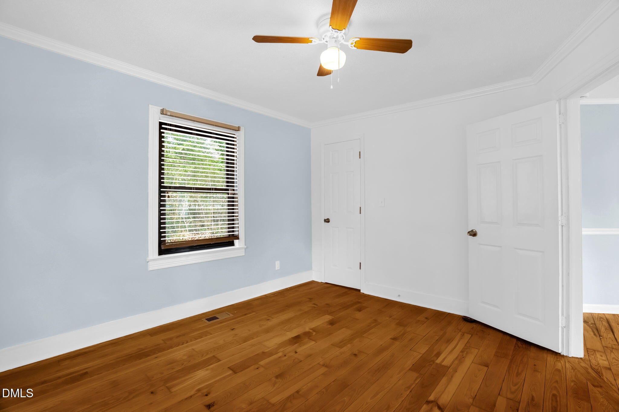 2807 Beck Road Durham, NC 27704 - Photo 11 of 35 a view of empty room with wooden floor and fan