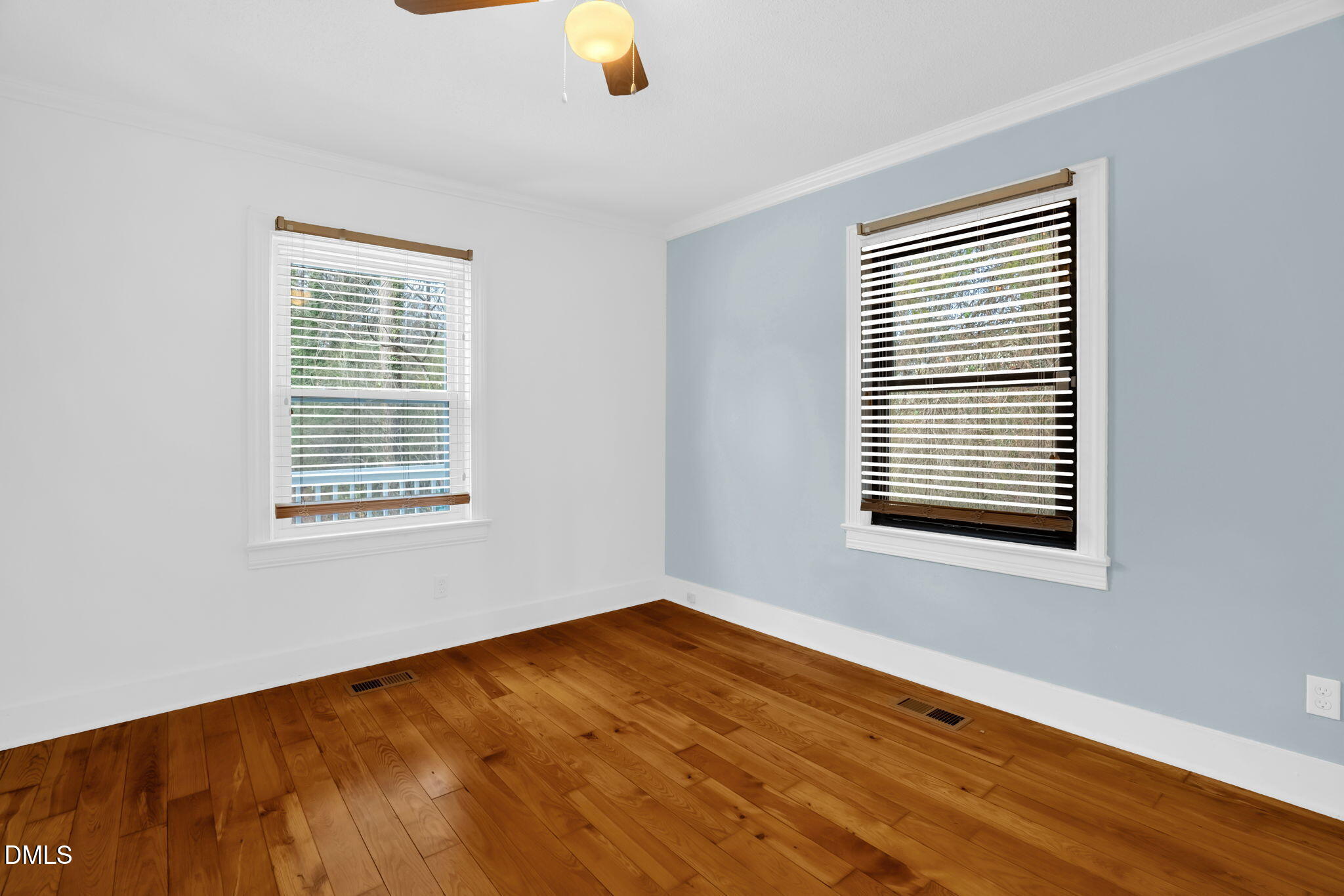 2807 Beck Road Durham, NC 27704 - Photo 12 of 35 a view of an empty room with wooden floor and a window