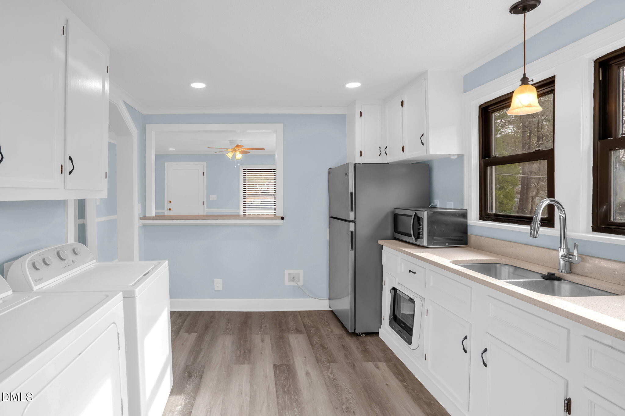 2807 Beck Road Durham, NC 27704 - Photo 14 of 35 a kitchen with a sink a refrigerator and window
