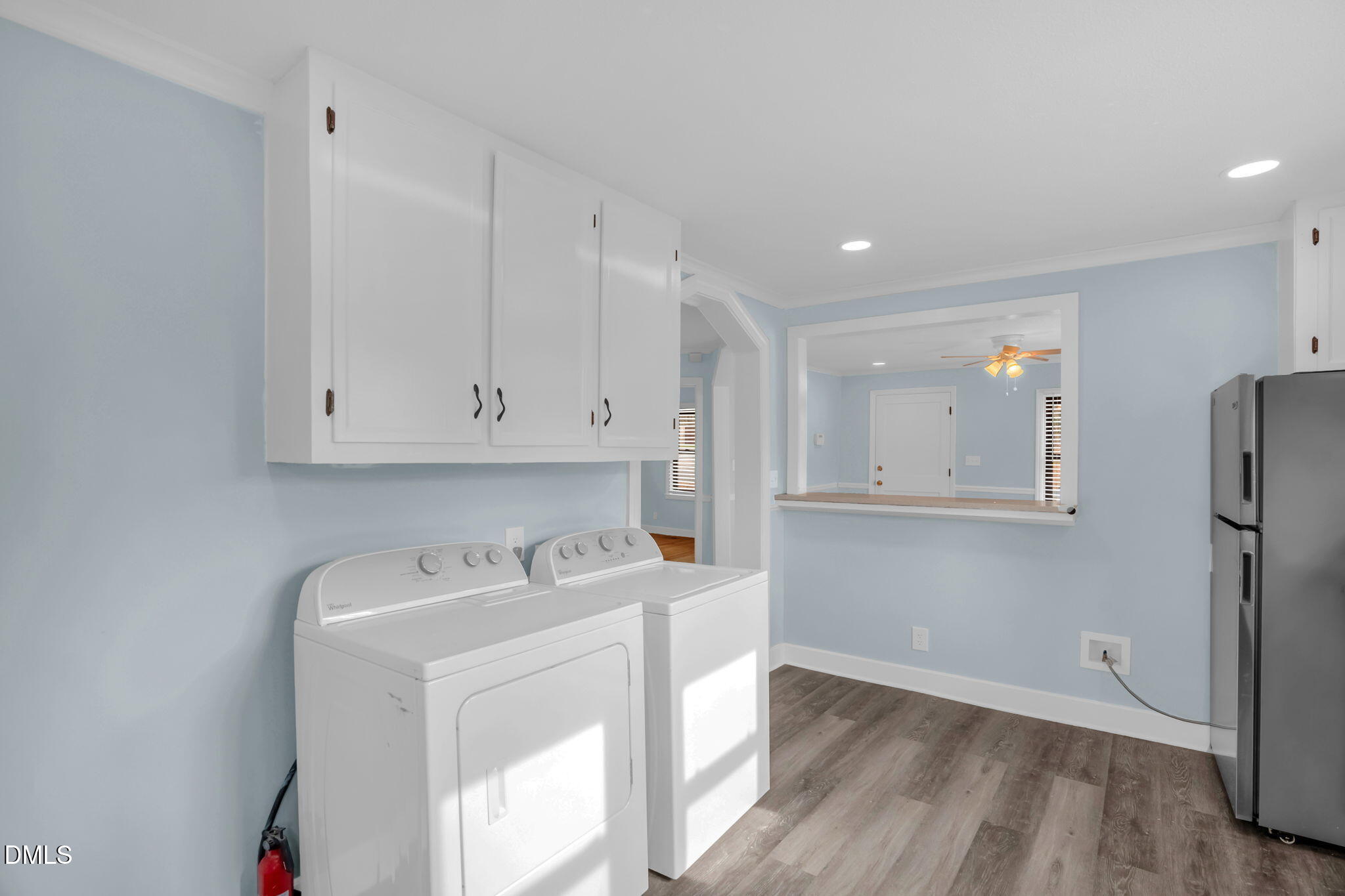 2807 Beck Road Durham, NC 27704 - Photo 15 of 35 a room with stainless steel appliances white cabinets and wooden floor