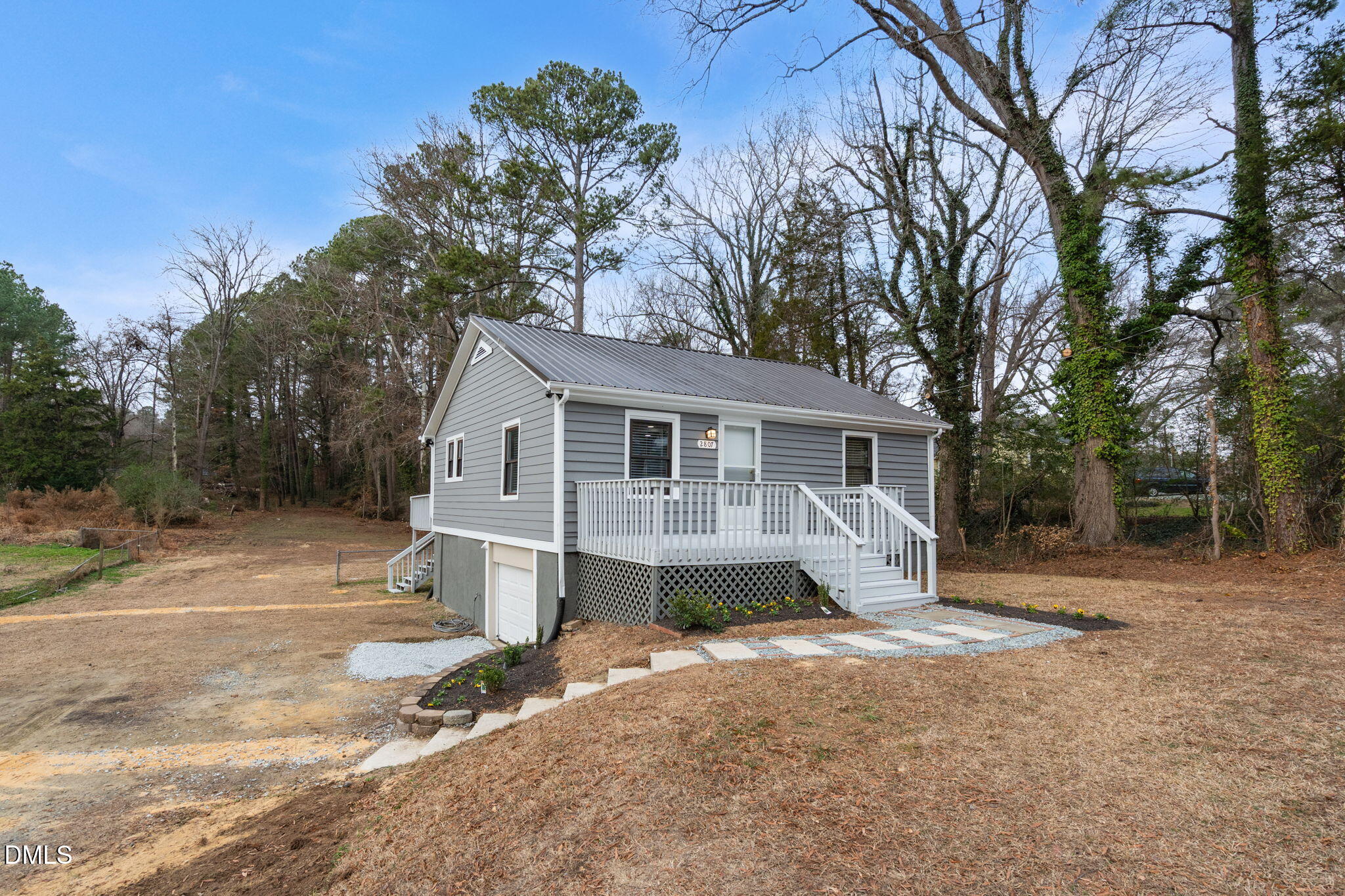 2807 Beck Road Durham, NC 27704 - Photo 3 of 35 a view of a house with a yard and large tree