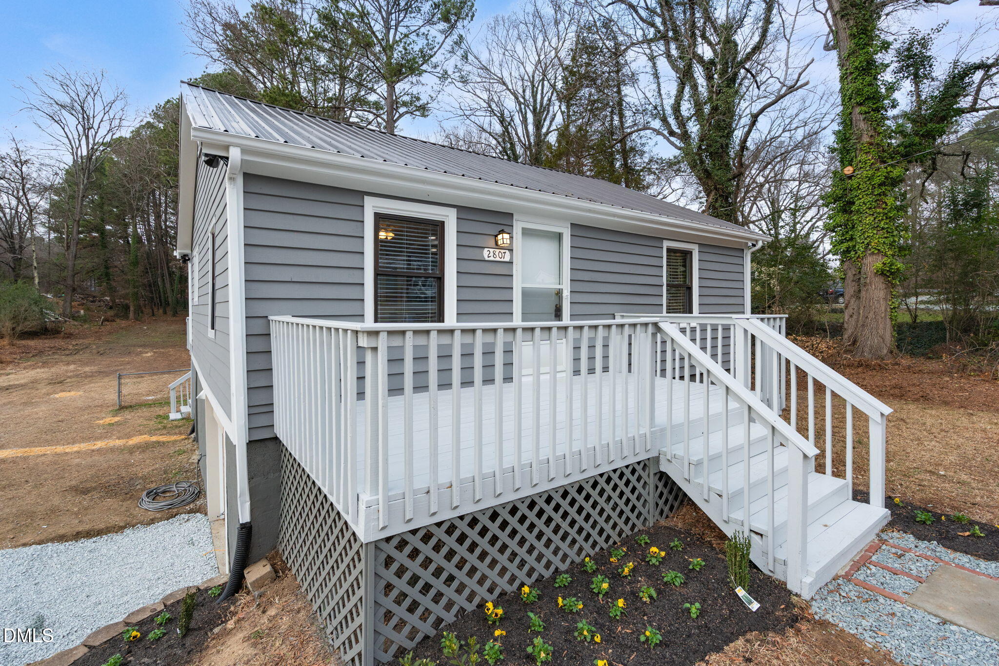 2807 Beck Road Durham, NC 27704 - Photo 4 of 35 a view of a house with wooden deck