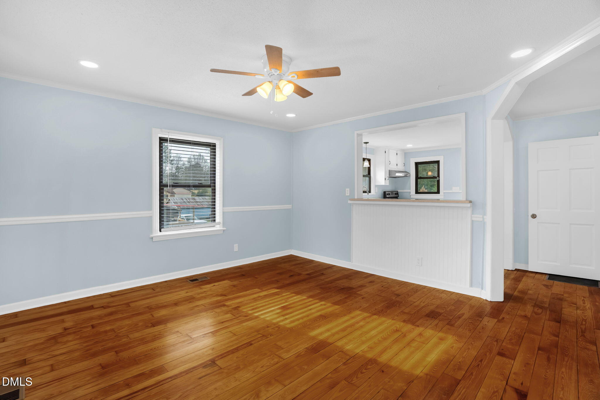 2807 Beck Road Durham, NC 27704 - Photo 7 of 35 a view of empty room with wooden floor and fan